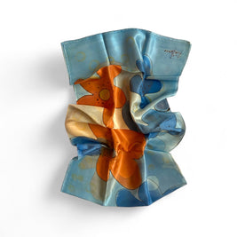 Magis Art Shop Ria Berec hand-painted blue and orange silk scarf with abstract floral patterns and artist signature.