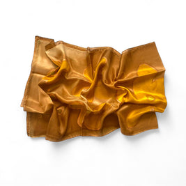 Magis Art Shop hand-painted brown and honey silk scarf with artistic patterns and a soft, lustrous texture.