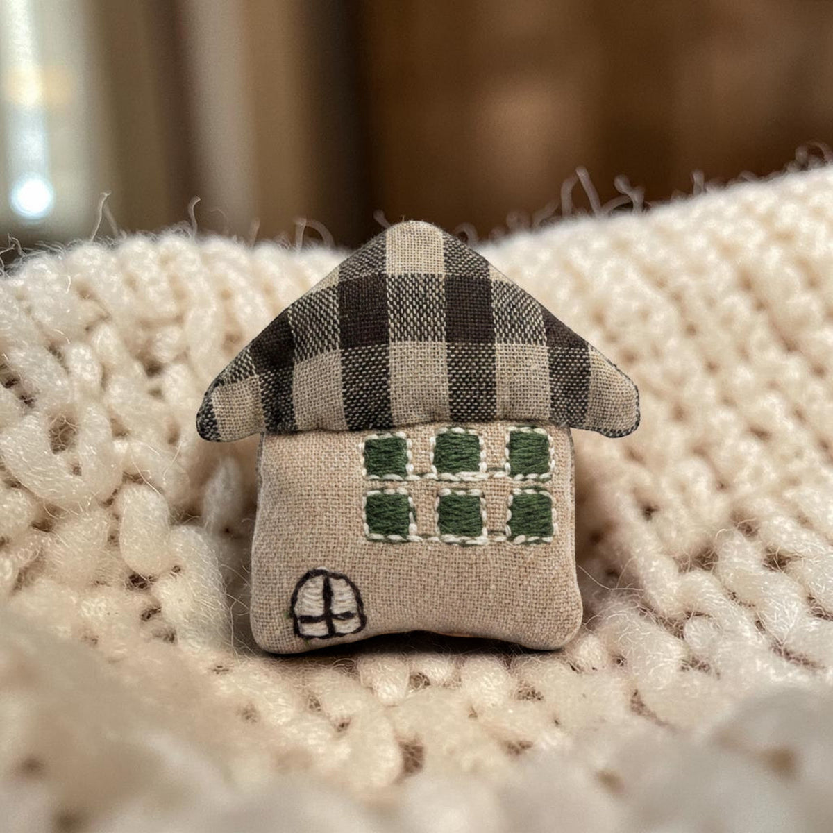 Magis Art Shop brown textile house brooch with a plaid roof and embroidered green windows