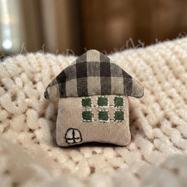 Magis Art Shop brown textile house brooch with a plaid roof and embroidered green windows