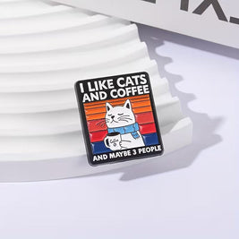 Magis Art Shop enamel pin featuring a cat holding a coffee mug with the text I like cats and coffee and maybe 3 people