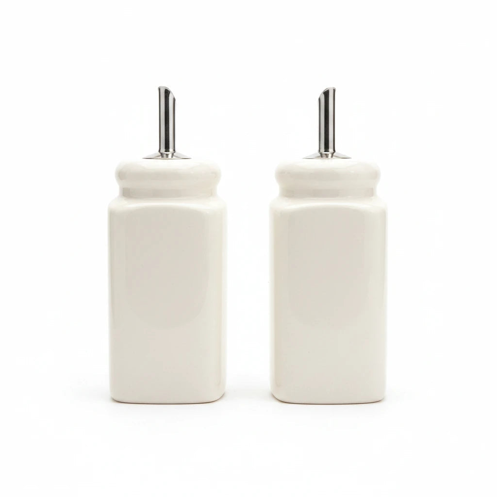 Magis Art Shop set of two white ceramic oil and vinegar dispensers with stainless steel pourer spouts