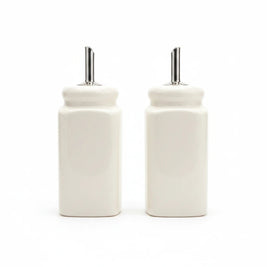 Magis Art Shop set of two white ceramic oil and vinegar dispensers with stainless steel pourer spouts