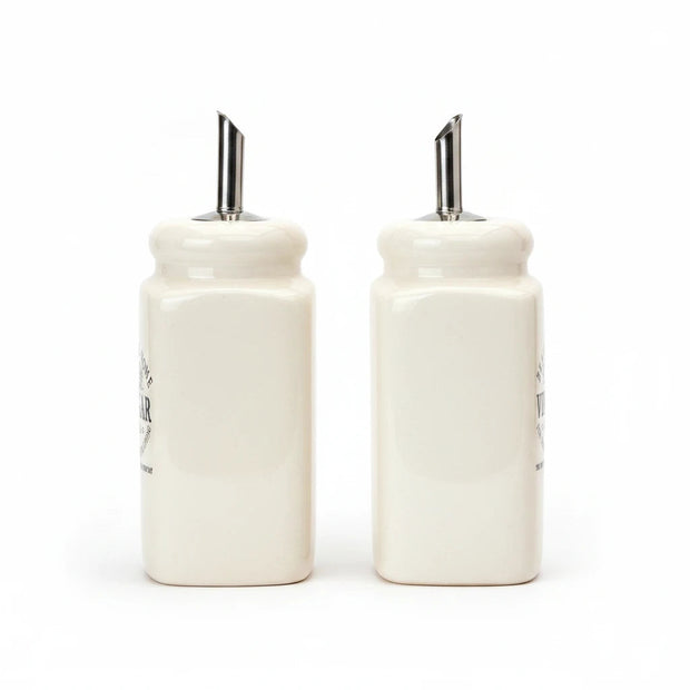Magis Art Shop set of two cream ceramic oil and vinegar cruets with stainless steel pourers, 13 cm tall