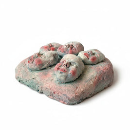 Magis Art Shop clay sculpture Tváre II by Róbert Szittay featuring multiple expressive faces on a textured base