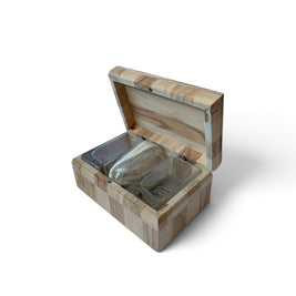 Magis Art Shop glass oil lamps with metal tubes and wicks stored in a decorative wooden box for cozy home lighting.