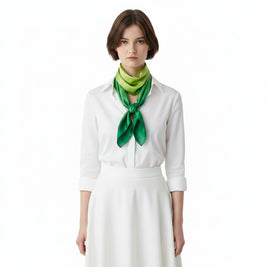 Magis Art Shop hand-painted green silk scarf worn by a woman in a white shirt
