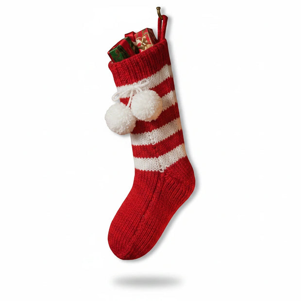 Magis Art Shop hand-knitted red and white striped Christmas stocking with white pom-poms and gift box inside