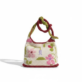 Magis Art Shop handmade Gry and Sif knit shoulder bag featuring a cream base with pink floral patterns and green trim