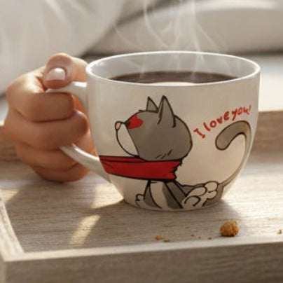 Magis Art Shop ceramic mug with I LOVE you NICI cat illustration on a breakfast tray in a cozy bedroom setting