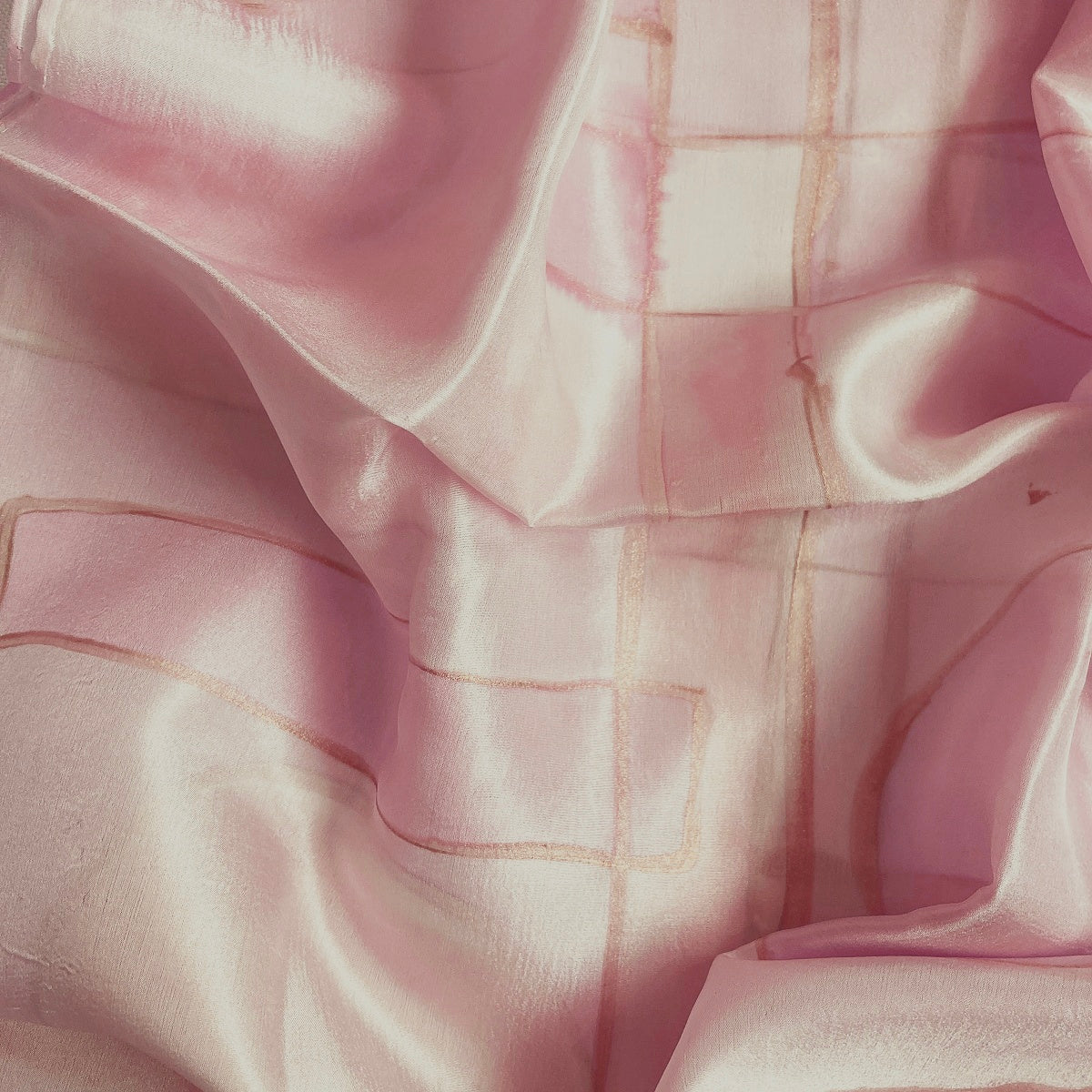Magis Art Shop hand-painted light pink silk scarf with subtle grid pattern and soft fabric folds