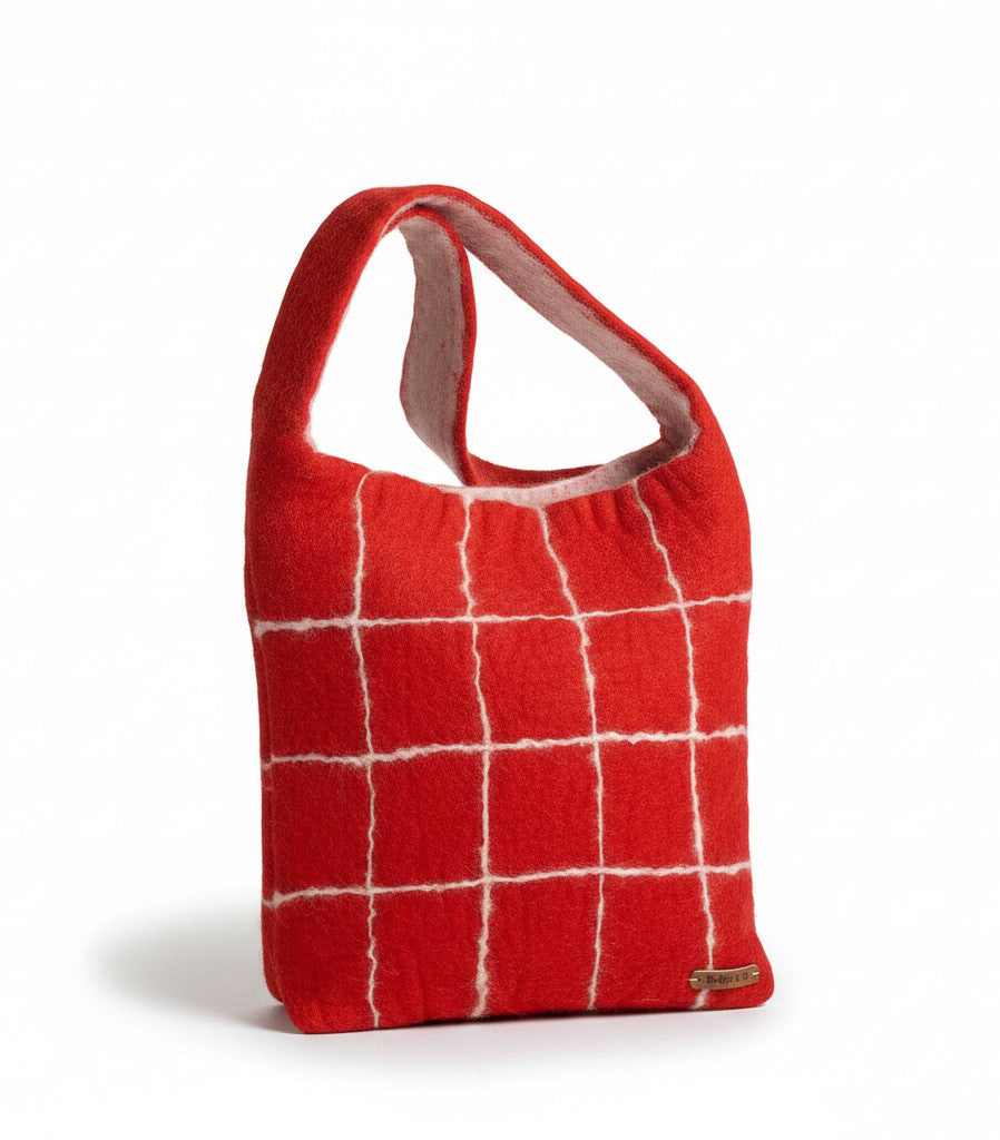 Magis Art Shop handmade red felt bag by Gry and Sif with a white grid pattern and a small branded metal tag