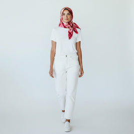 Magis Art Shop Elena Ruta Marchallé red silk scarf worn by a model in a white t-shirt and jeans