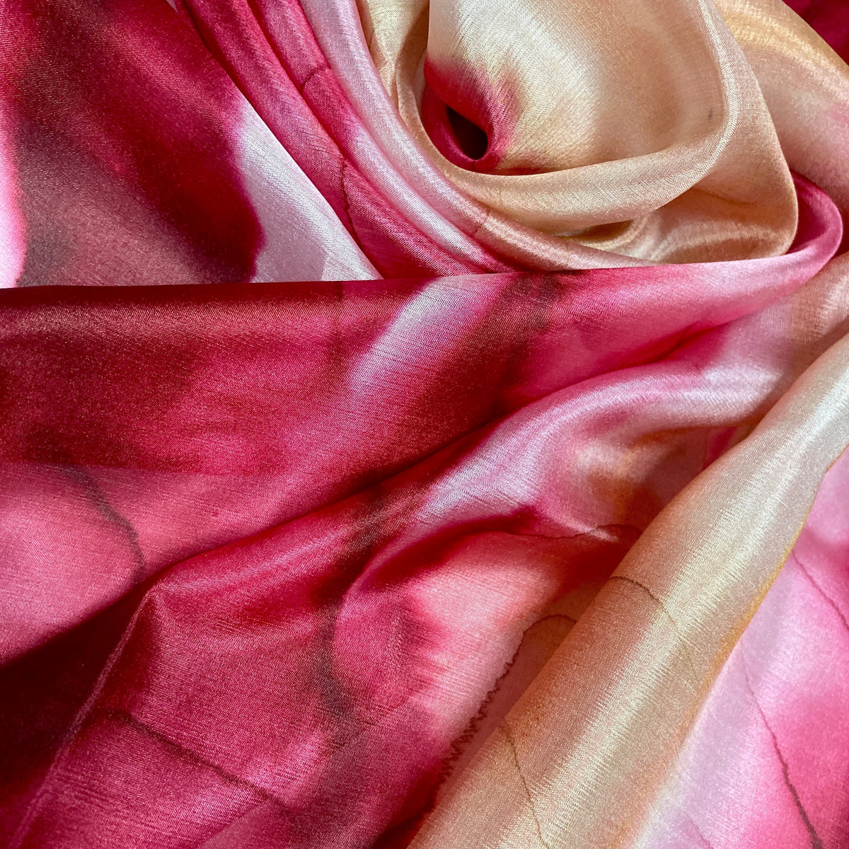 Magis Art Shop Elena Ruta Marchallé red silk scarf with a soft, flowing tie-dye pattern and lustrous finish.
