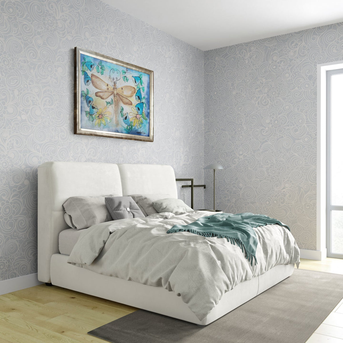Magis Art Shop silk painting of a dragonfly with gold details and floral wreath hanging above a modern white bed