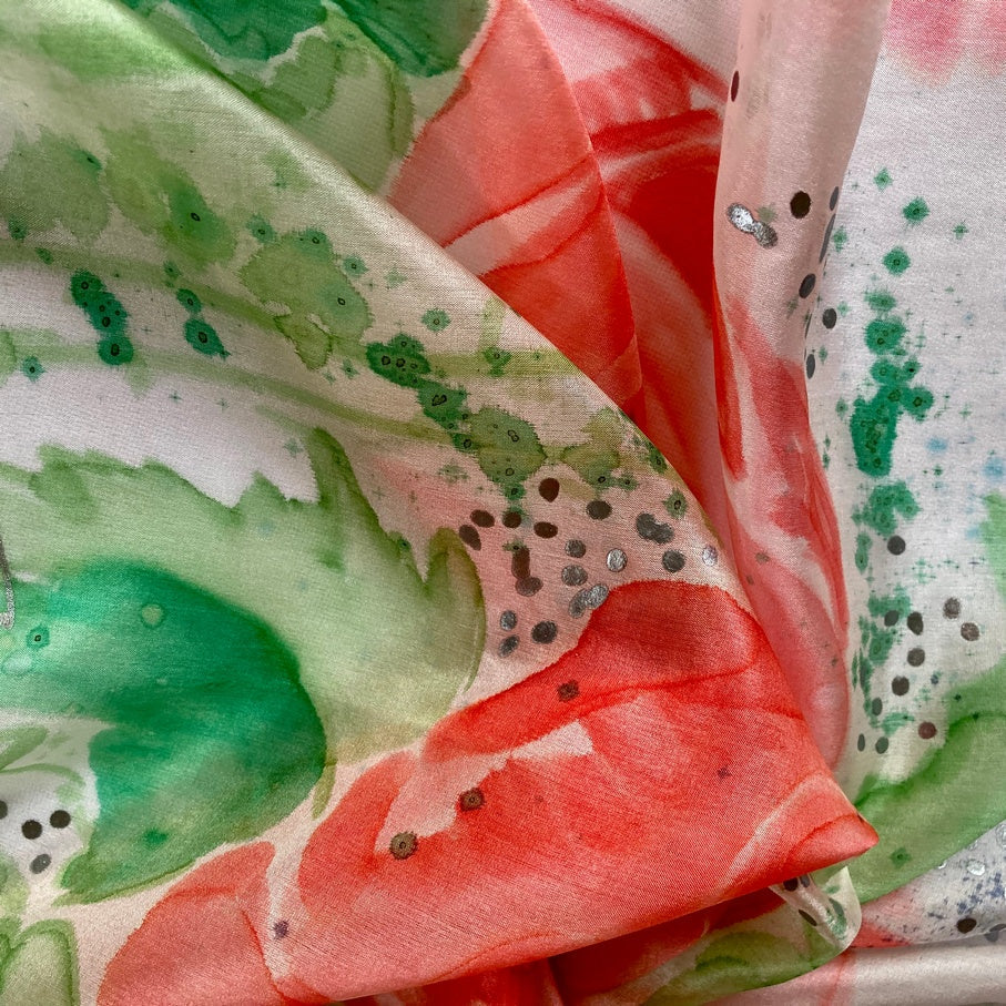 Magis Art Shop silk scarf with watercolor rose print in shades of red, green, and silver accents.