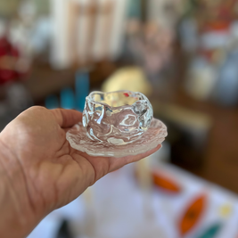 Magis Art Shop small clear glass cup with matching textured saucer held in a hand