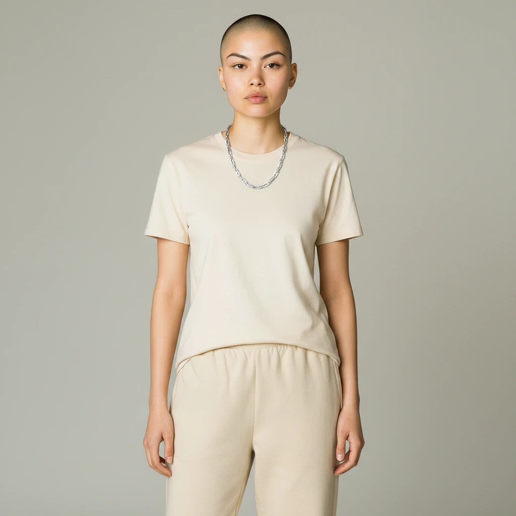 Magis Art Shop stainless steel chain necklace with rectangular links worn by a model in a beige t-shirt