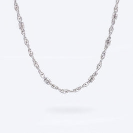 Magis Art Shop stainless steel chain necklace featuring decorative silver-toned rings along a 50 cm twisted link chain