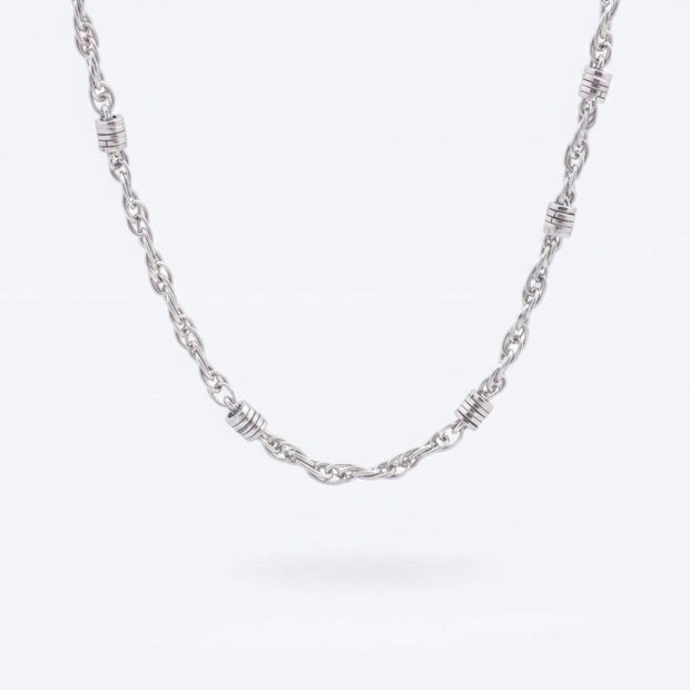 Magis Art Shop stainless steel chain necklace featuring decorative silver-toned rings along a 50 cm twisted link chain