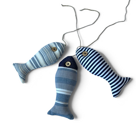 Magis Art Shop hanging fabric fish ornaments in grey, blue, and white stripes with wooden button eyes