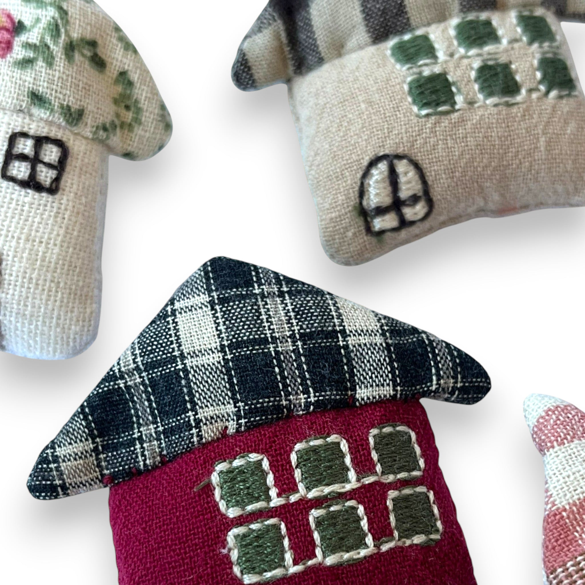Magis Art Shop handmade textile house brooches with floral, plaid, and embroidered details in various colors.