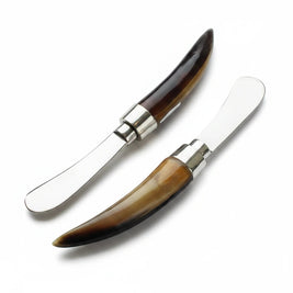 Magis Art Shop butter knife set with polished steel blades and unique dark and light tortoise bone handles.