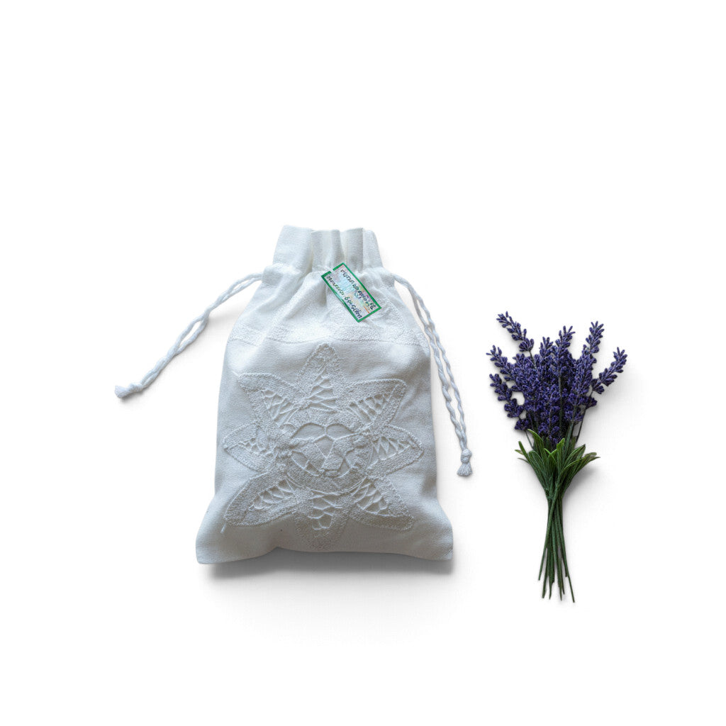 Magis Art Shop white cotton drawstring pouch with delicate lace embroidery, perfect for herbs or small gifts.