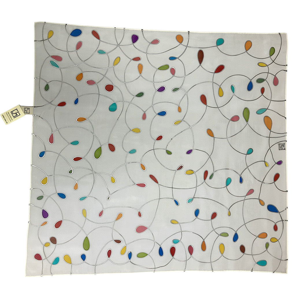 Magis Art Shop white silk scarf by Jana Melichová featuring a delicate hand-painted pattern of colorful teardrops.