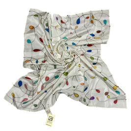 Magis Art Shop white silk scarf by Jana Melichova featuring colorful teardrop patterns and silver accents.