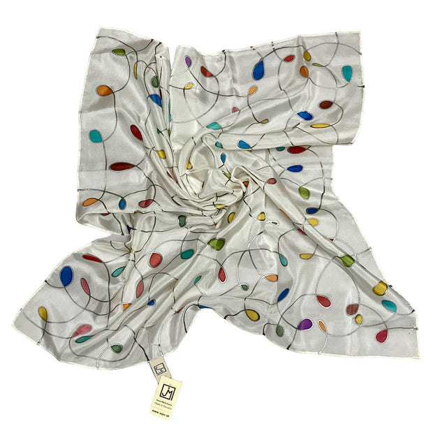 Magis Art Shop white silk scarf by Jana Melichova featuring colorful teardrop patterns and silver accents.