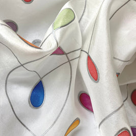 Magis Art Shop white silk scarf by Jana Melichová featuring colorful teardrop patterns and silver outlines.