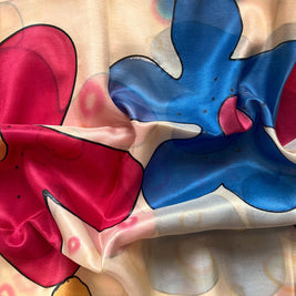 Magis Art Shop hand-painted yellow silk scarf featuring vibrant blue and pink floral patterns with artistic contours